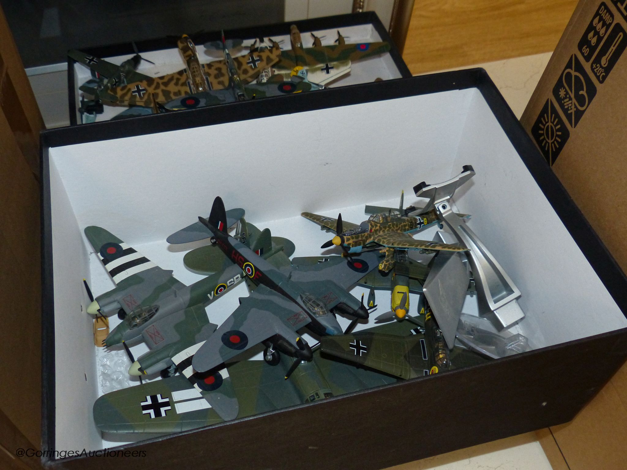 A collection of unboxed Corgi aviation models to include a large Lancaster in associated bespoke display case, the Heinkel HE 111, Stuka (x3), D H (de Havilland) Mosquito x2, together with others and a collection of die